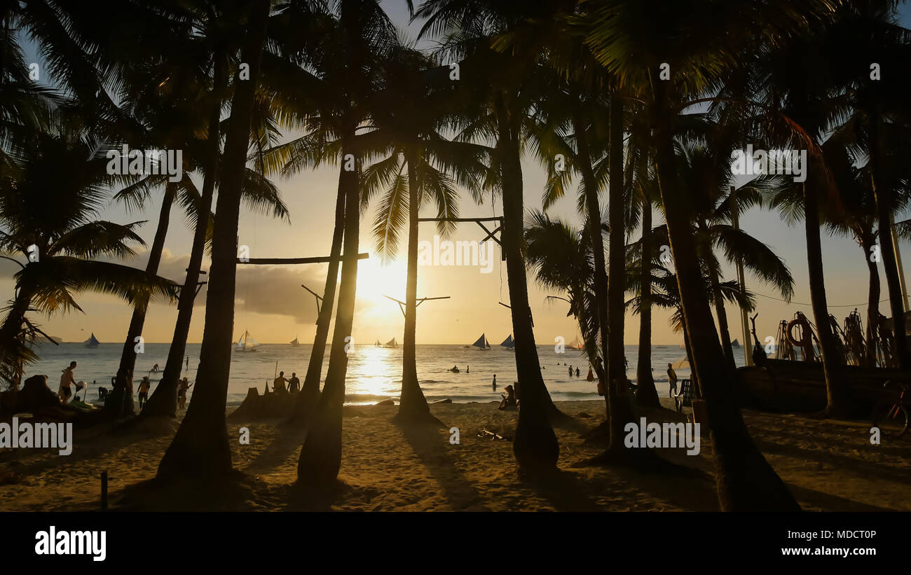 Beach With Silhouettes Of Tourists Among Palm Trees On The Island Of Boracay Palm Trees In The Rays Of Sunset Sailboats On The Water Philippine Tropics Stock Photo Alamy Register in less than 1 minute to use all the website features completely or use your facebook account! alamy