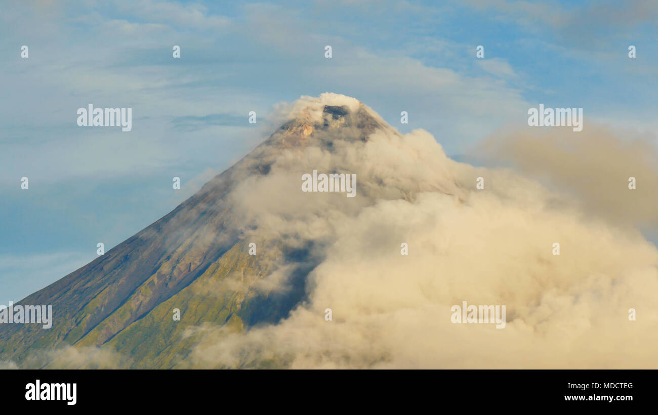 Mount Mayon Volcano in the province of Bicol, Philippines. Clouds Timelapse. Stock Photo