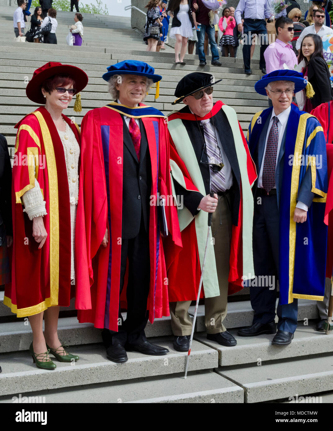 Chancellor Dr. Carole Taylor;  Dr. Steven Pinker;  Dr. Charles Crawford; University President Andrew Petter.  Simon Fraser University Convocation 2014 Stock Photo
