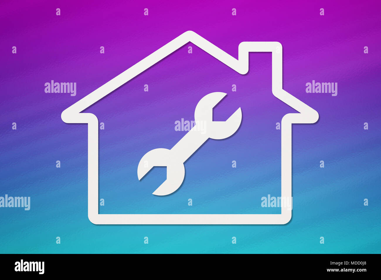 Paper house with wrench, spanner inside on colorful background. Housing