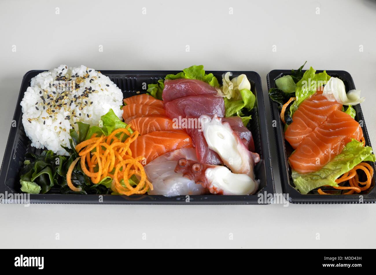 Sashimi with bluefin tuna, salmon, amberjack, octopus. As a vegetable