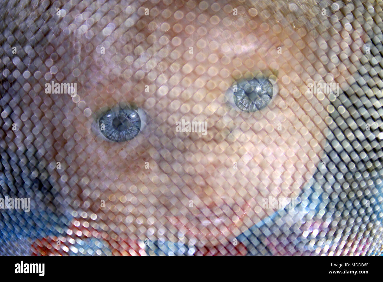 Creepy baby doll face Stock Photo
