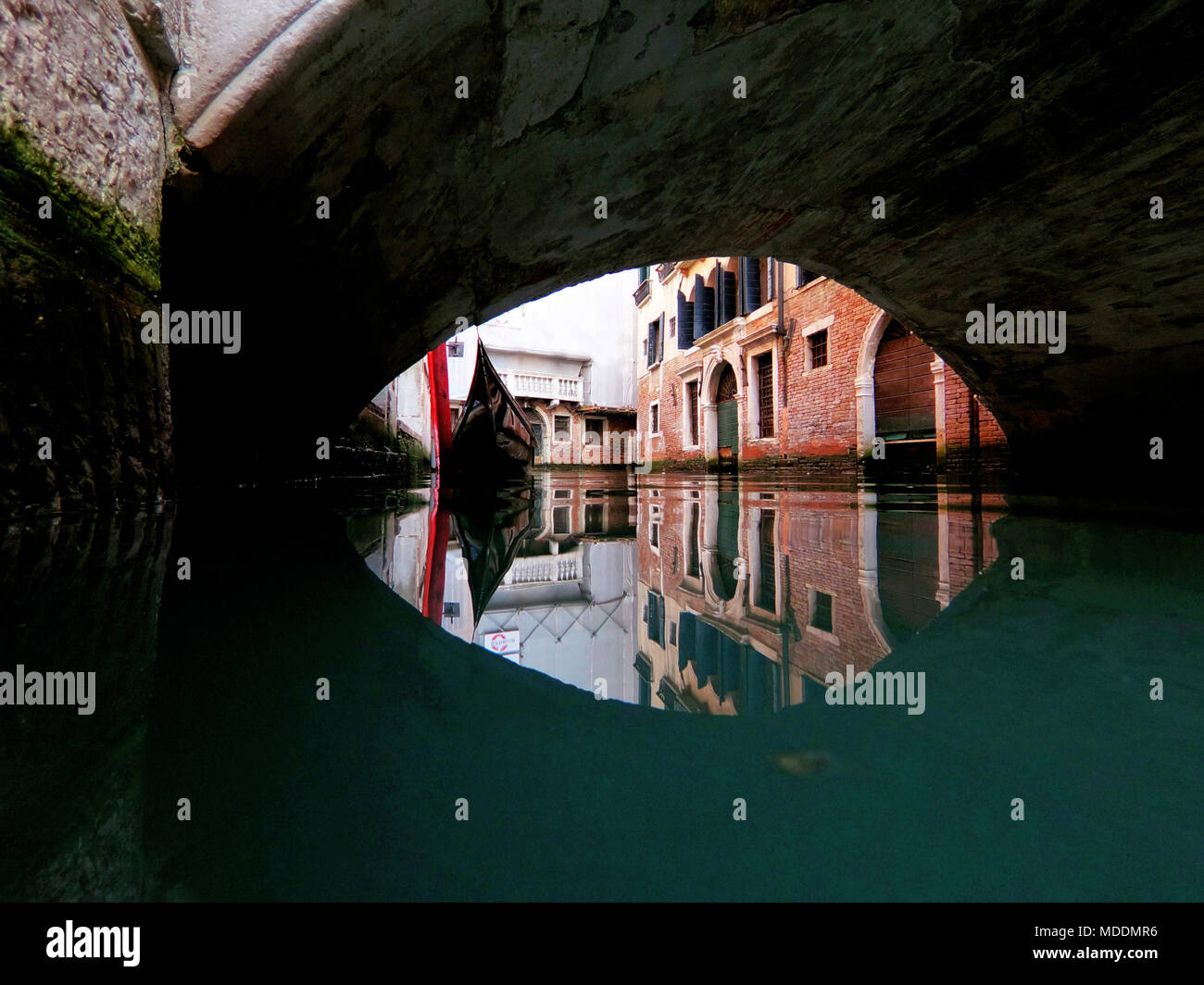 View on Venetian canal from water surface, Italy Stock Photo - Alamy