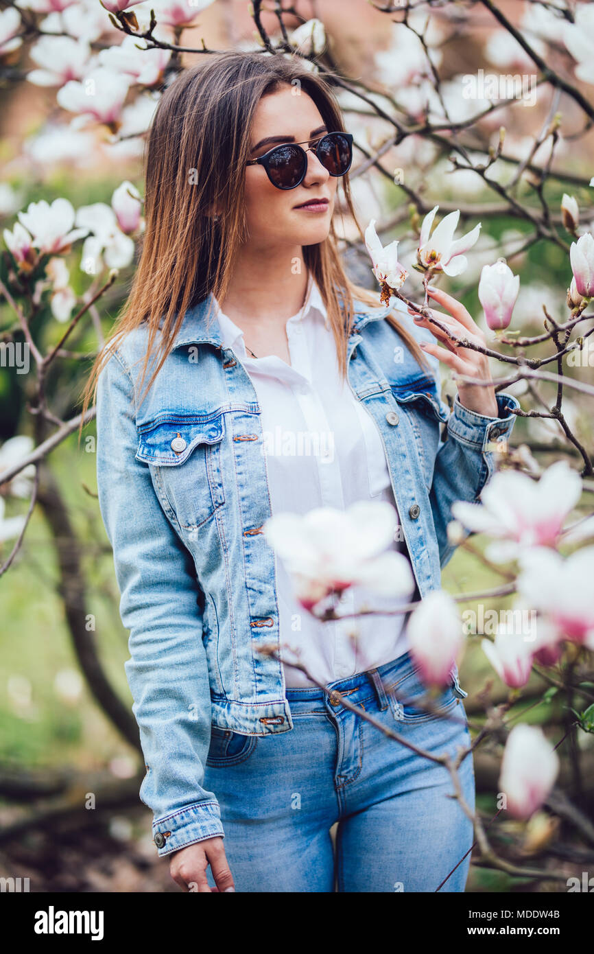 Spring Girl Beautiful Spring Girl with flowers of magnolia tree Stock Photo - Alamy