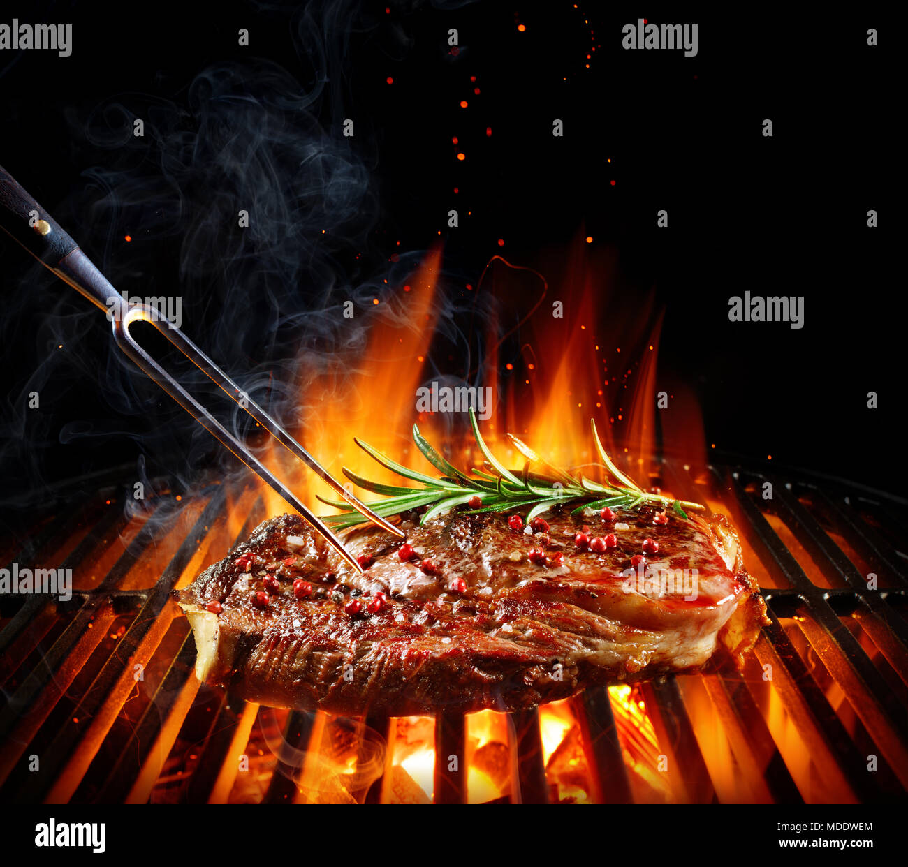 Entrecote Beef Steak On Grill With Rosemary Pepper And Salt Stock Photo