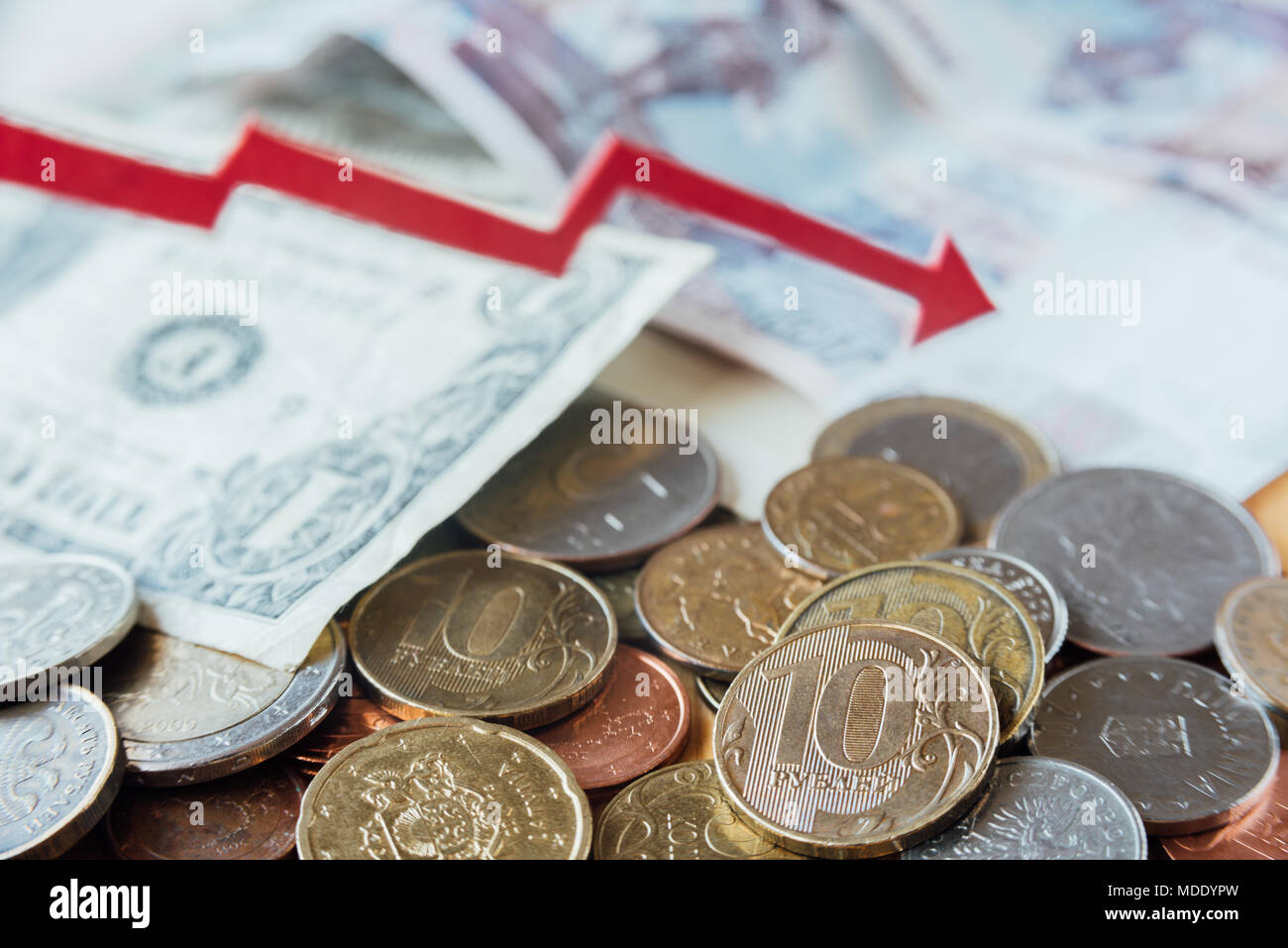 Rubles, dollar and euro with red trend line. Falling trend Stock Photo