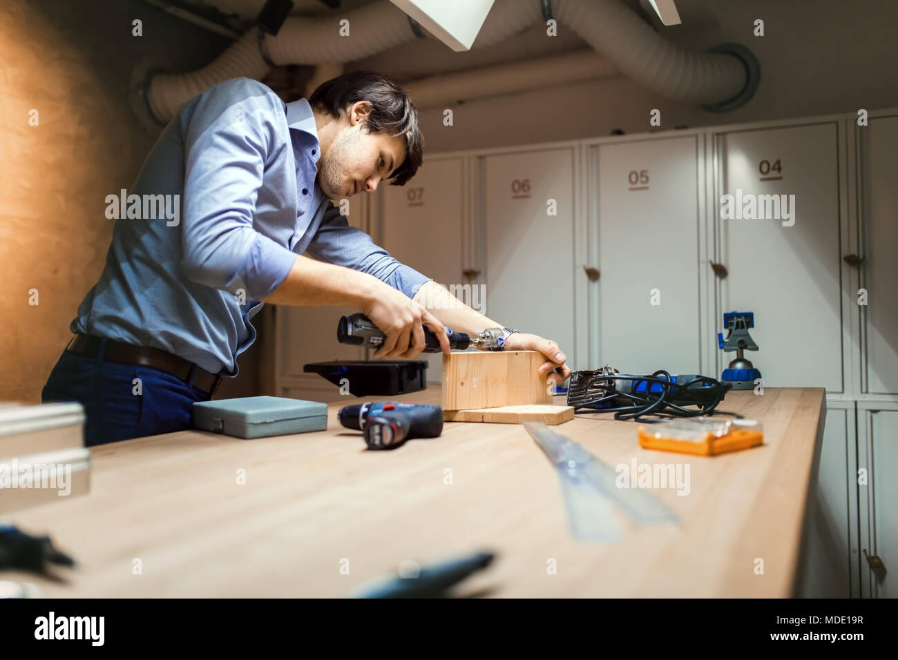 Handyman working with wood Stock Photo