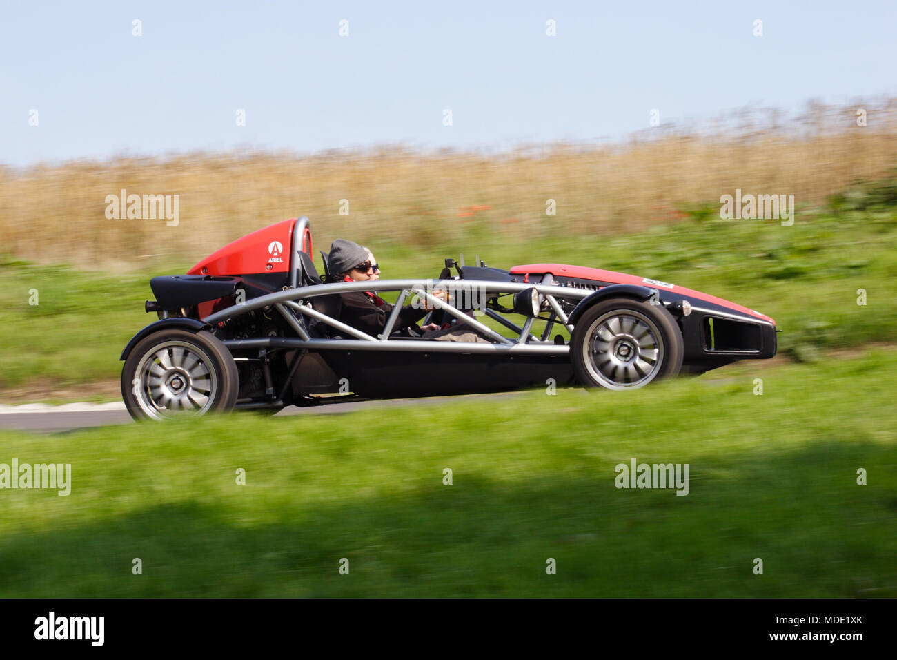 Profile (side view) Ariel Atom 2 seat two-seater lightweight sports car track car driving fast. Transparent see-through visible car exoskeleton. Stock Photo