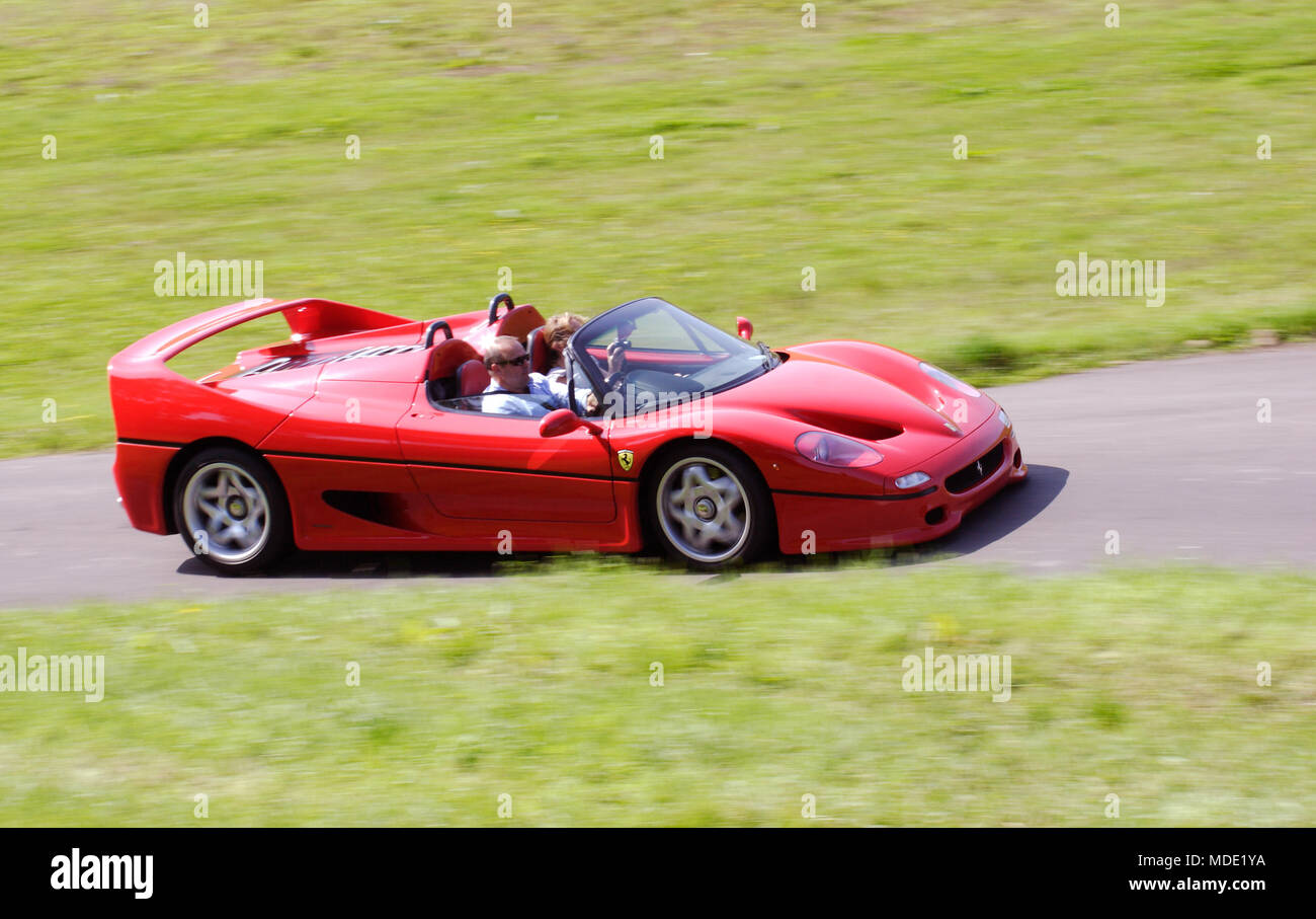 Red V12 Ferrari F50 90s 1990s super car hypercar driving fast Stock Photo