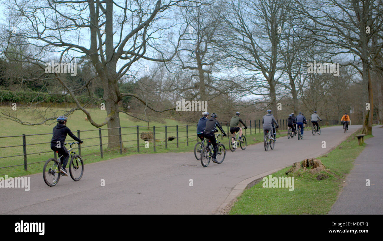 Pollock  country park group of cyclists riding cycle club outing bicycles outdoor fitness friends large crowd of enthusiasts Stock Photo