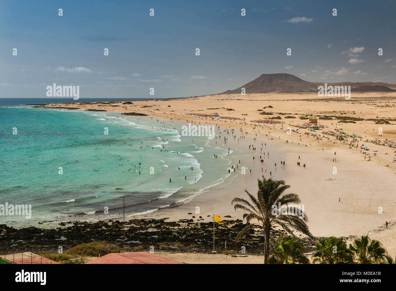 Aerial view of Corralejo Beach and its dunes crowded with tourists in Fuerteventura, Spain. Stock Photo
