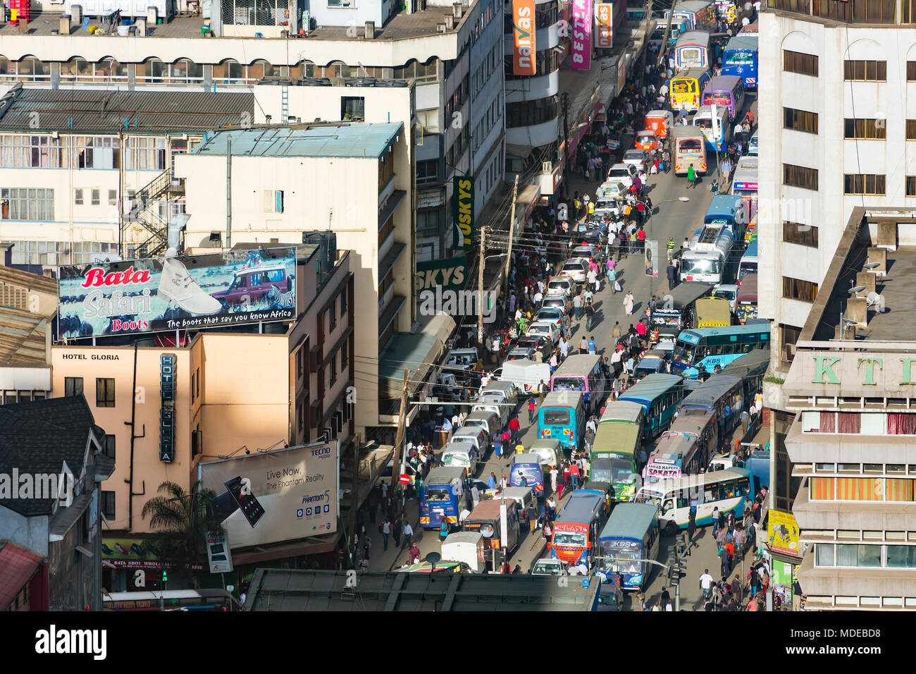 Nairobi, Kenya - December 23: Work and Christmas traffic with Matatus during rush hour on Ronald Ngala Street in Nairobi, Kenya on December 23, 2015 Stock Photo
