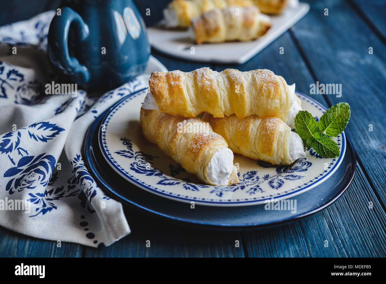 Delicious cream horns filled with vanilla cream Stock Photo Alamy