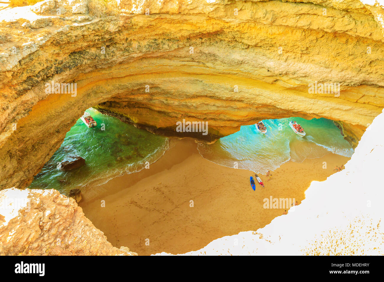 Algarve coast, Portugal. Aerial view of most impressive sea caves in Europe. Benagil Cave with boat trips leading to visit the caves from Praia de Benagil. Algar de Benagil is only accessible by sea. Stock Photo