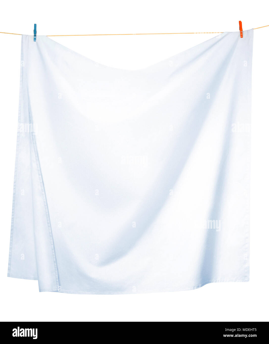White linen sheets drying on a rope, isolated on a white background, with clipping paths Stock Photo