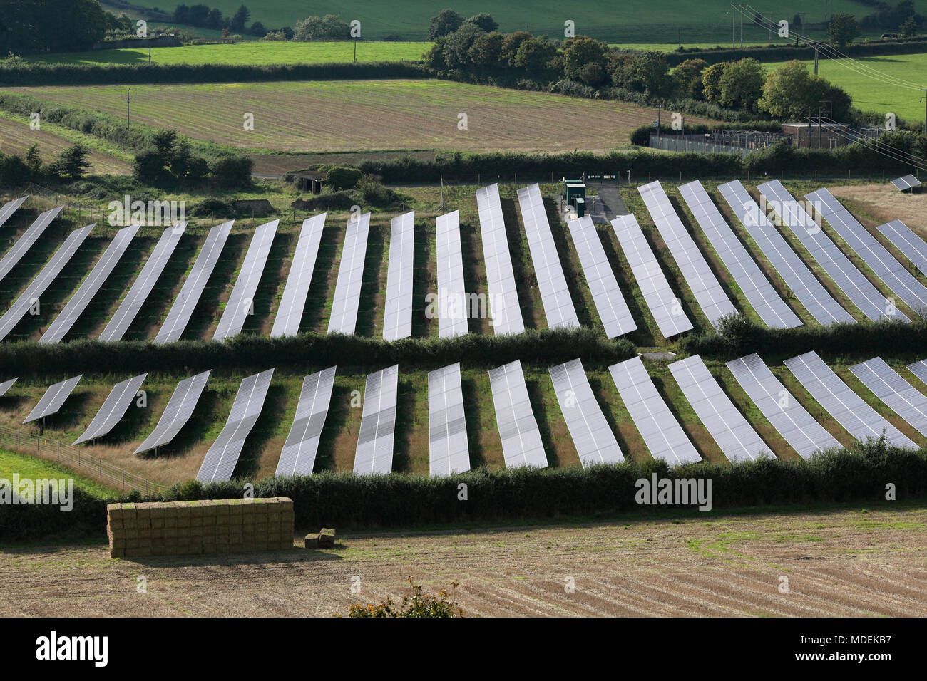 Looking down on the photovoltaic arrays that comprise the Milborne Port Solar Farm, near Milborne Port, Somerset. Stock Photo