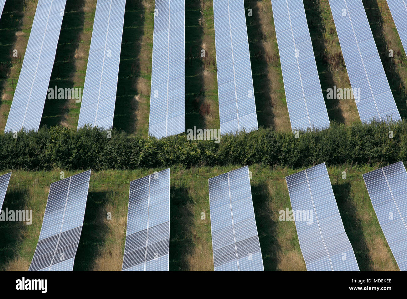 Looking down on some of the photovoltaic arrays that comprise the Milborne Port Solar Farm, near Milborne Port, Somerset. Stock Photo
