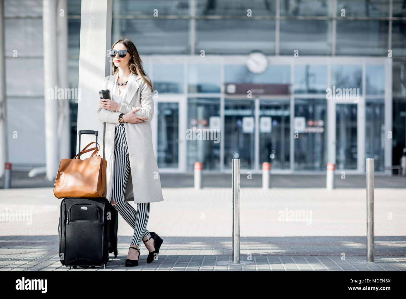 Business woman standing in airport hi-res stock photography and images ...