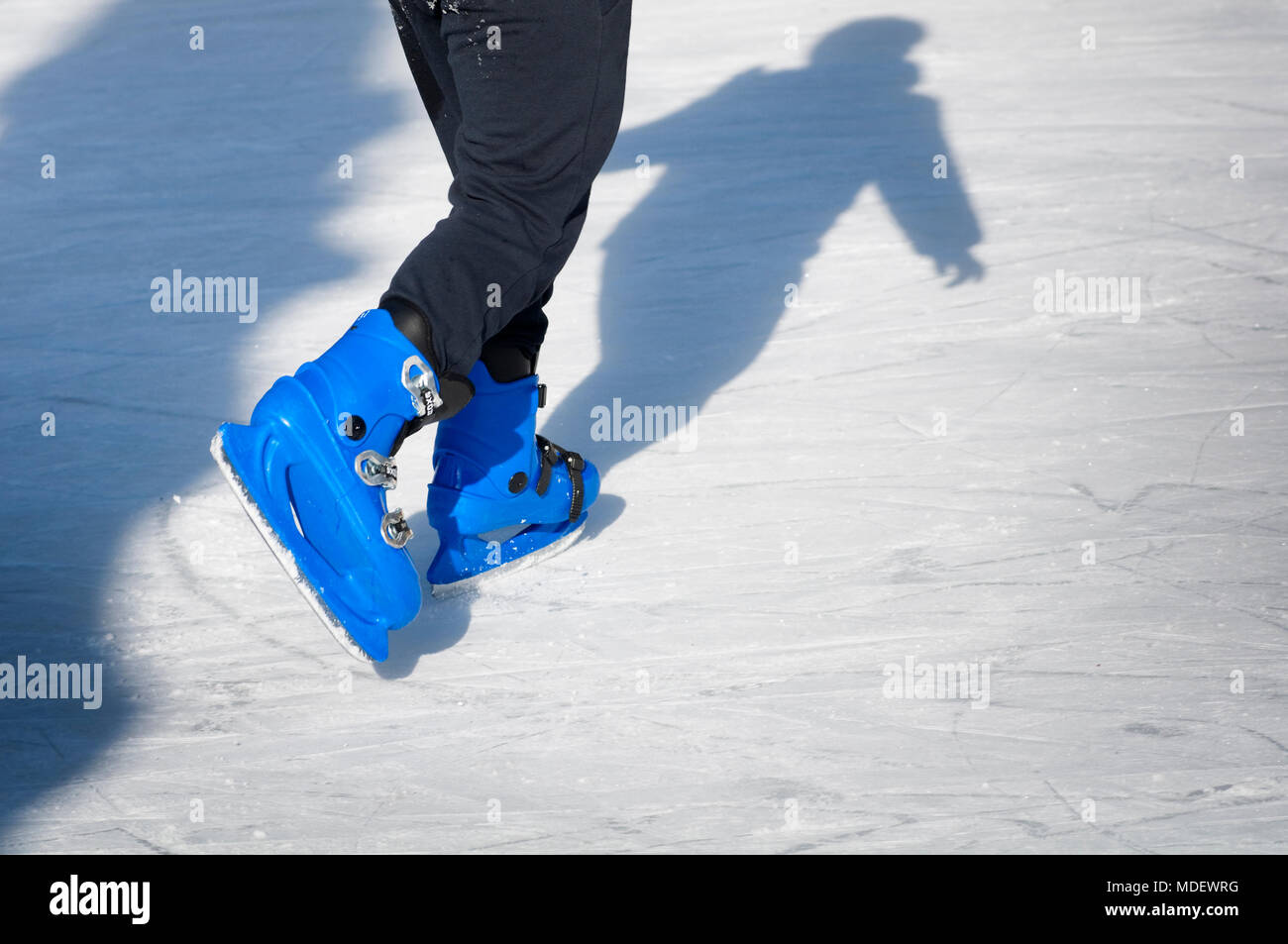 Shadow of Figure Skater on Ice Stock Photo