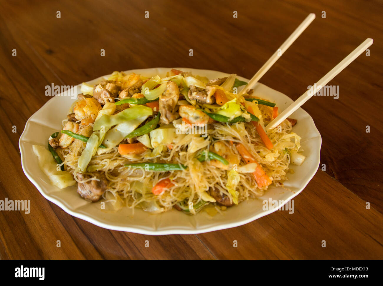 Fried Rice Noodles With Shrimp, Chicken and Vegetables Stock Photo