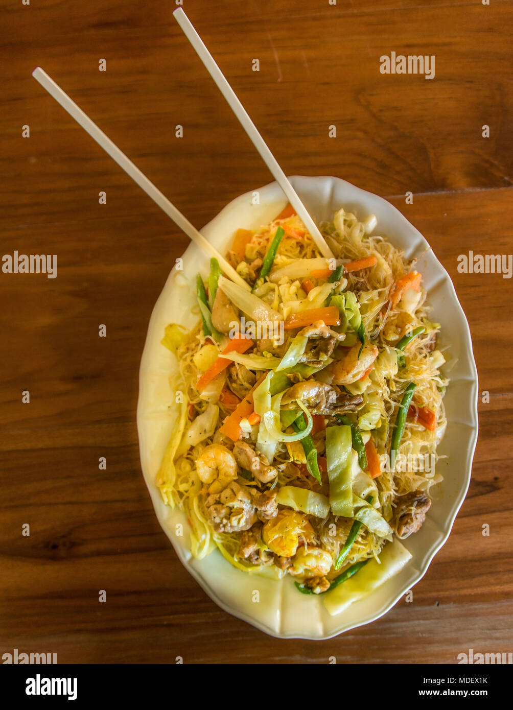 Fried Rice Noodles With Shrimp, Chicken and Vegetables Stock Photo - Alamy
