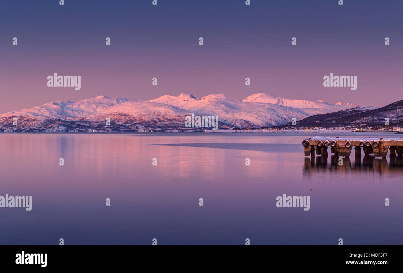 A view towards the mountains of Ringvassøya, Troms, Norway in Winter. Stock Photo