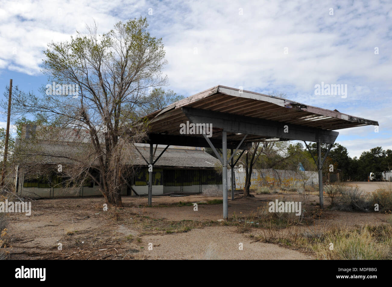 An abandoned, overgrown gas station along old Route 66 in Continental Divide, New Mexico. Stock Photo