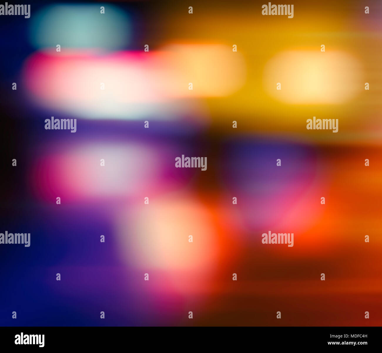 Abstract blurred background. Multicolored light spots on a dark background. Stock Photo