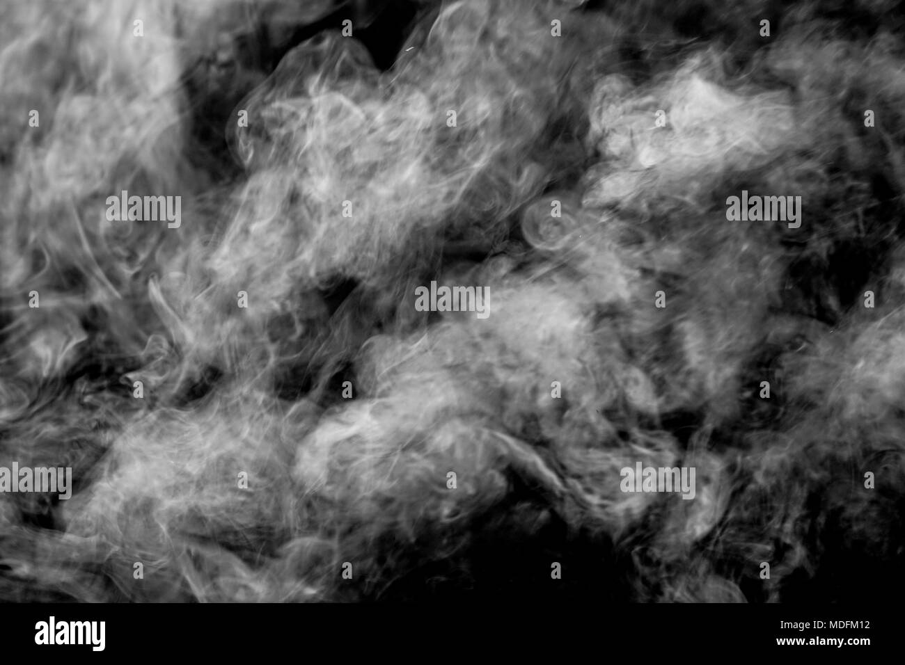 Abstract White smoke isolated on black background. Abstract smog clouds. Stock Photo