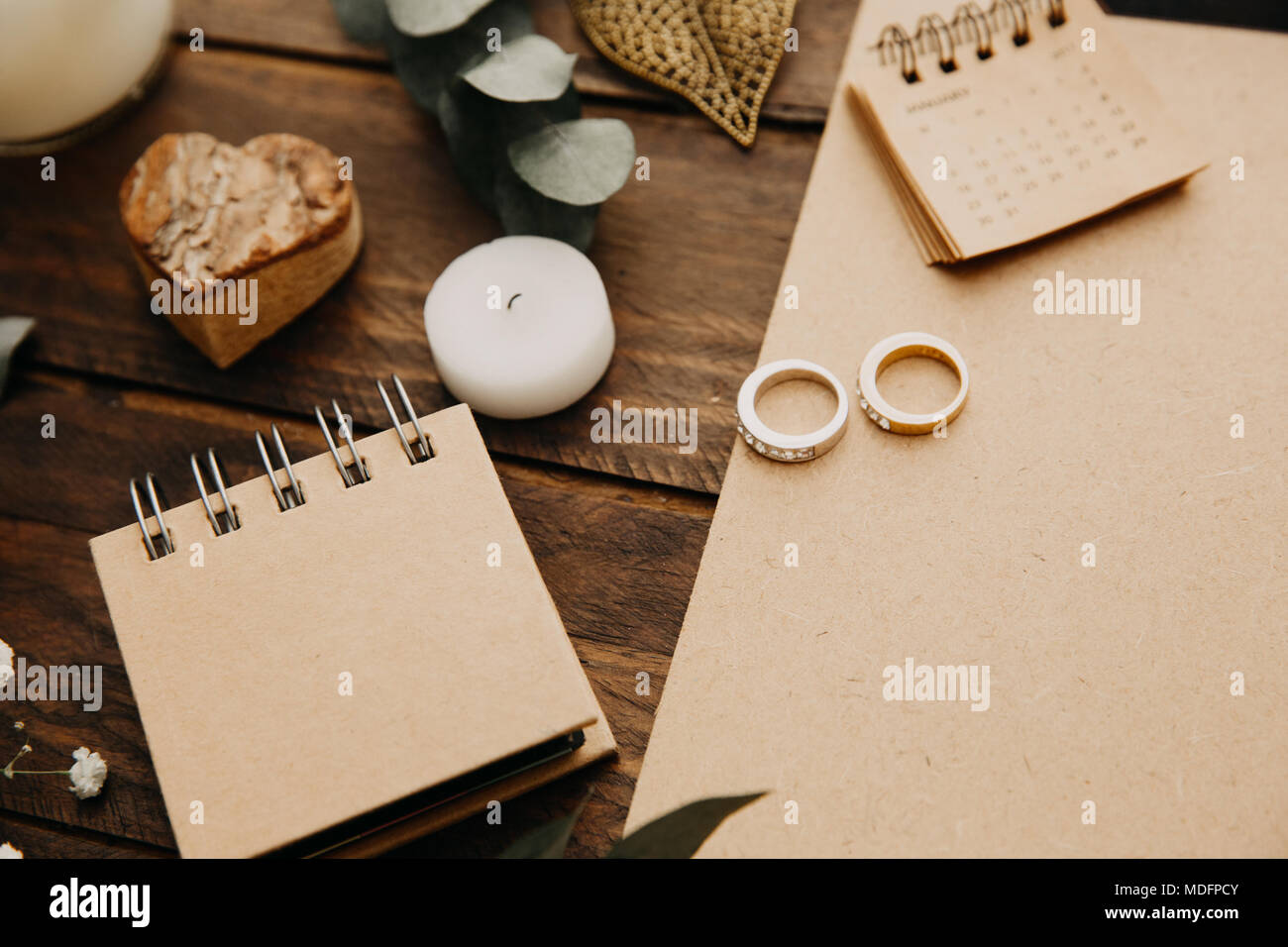 Wedding rings, notepad and calendar Stock Photo