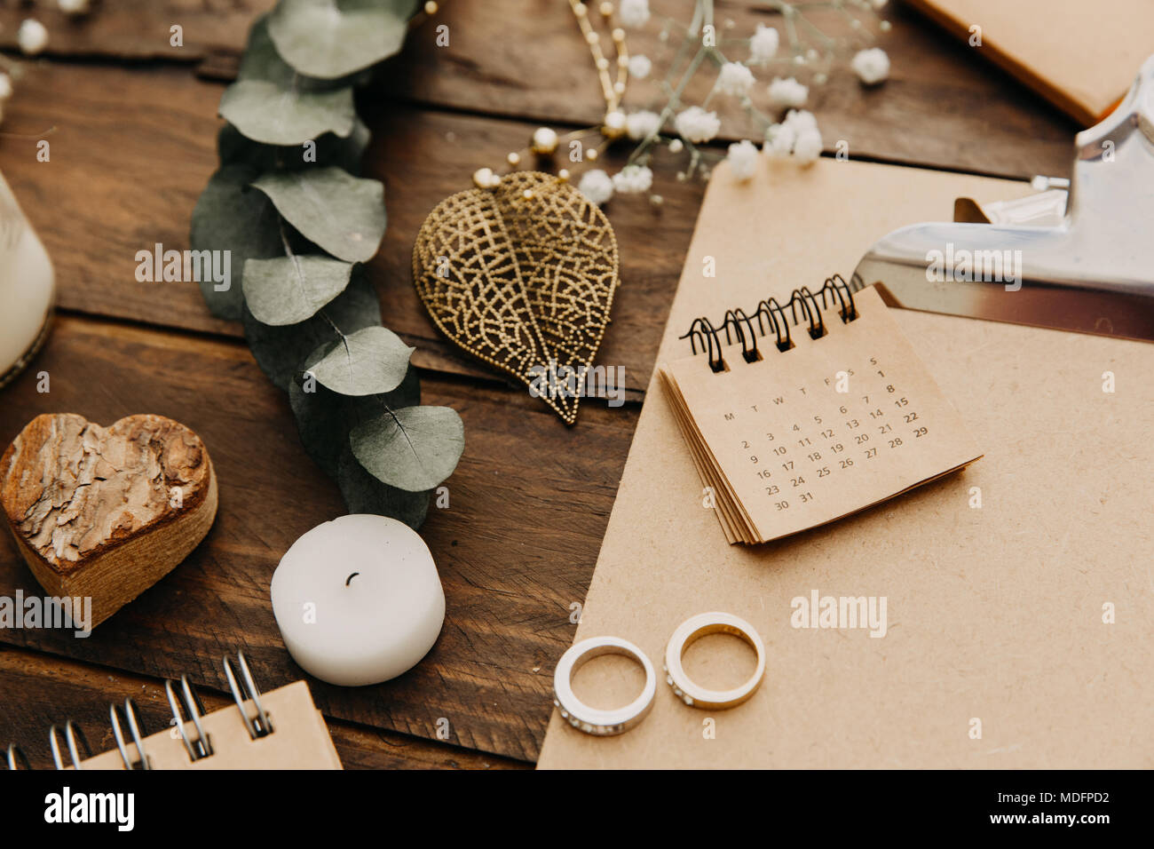 Wedding rings, notepad and calendar Stock Photo