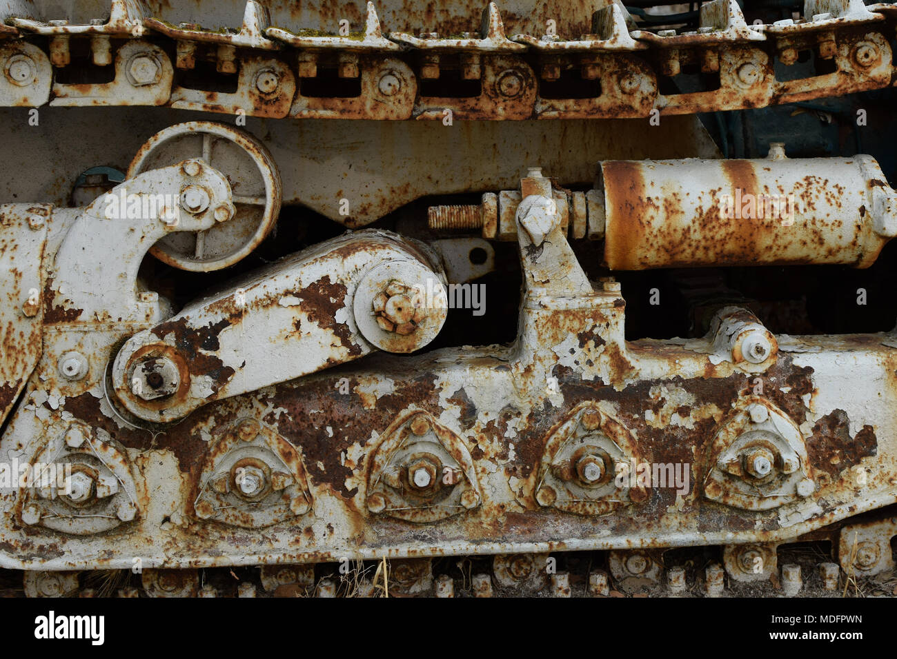 Rusty industrial machinery heavy equipment vehicle continuous track closeup. Stock Photo