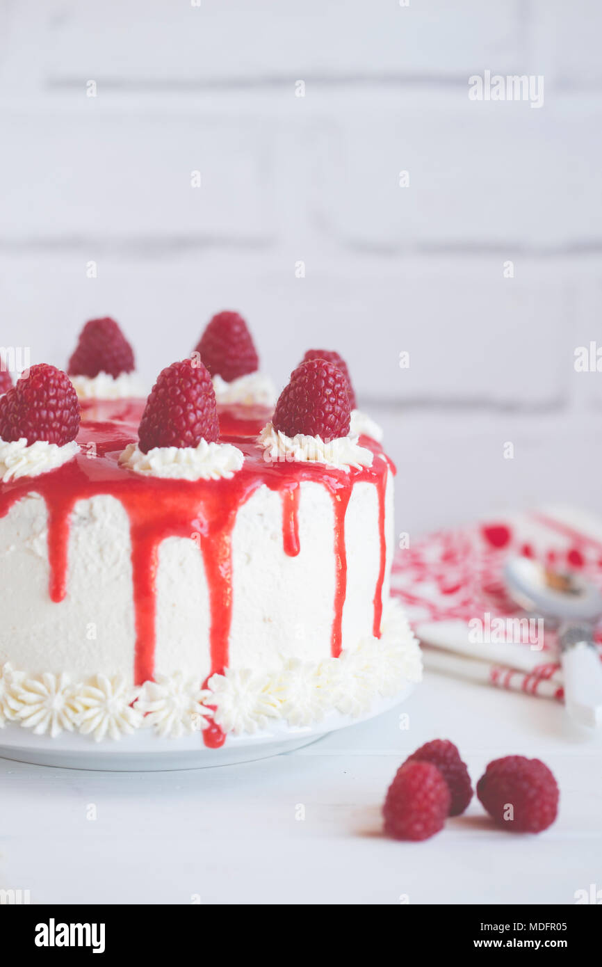 Sponge cake with raspberries, cream with raspberry coulis Stock Photo Alamy