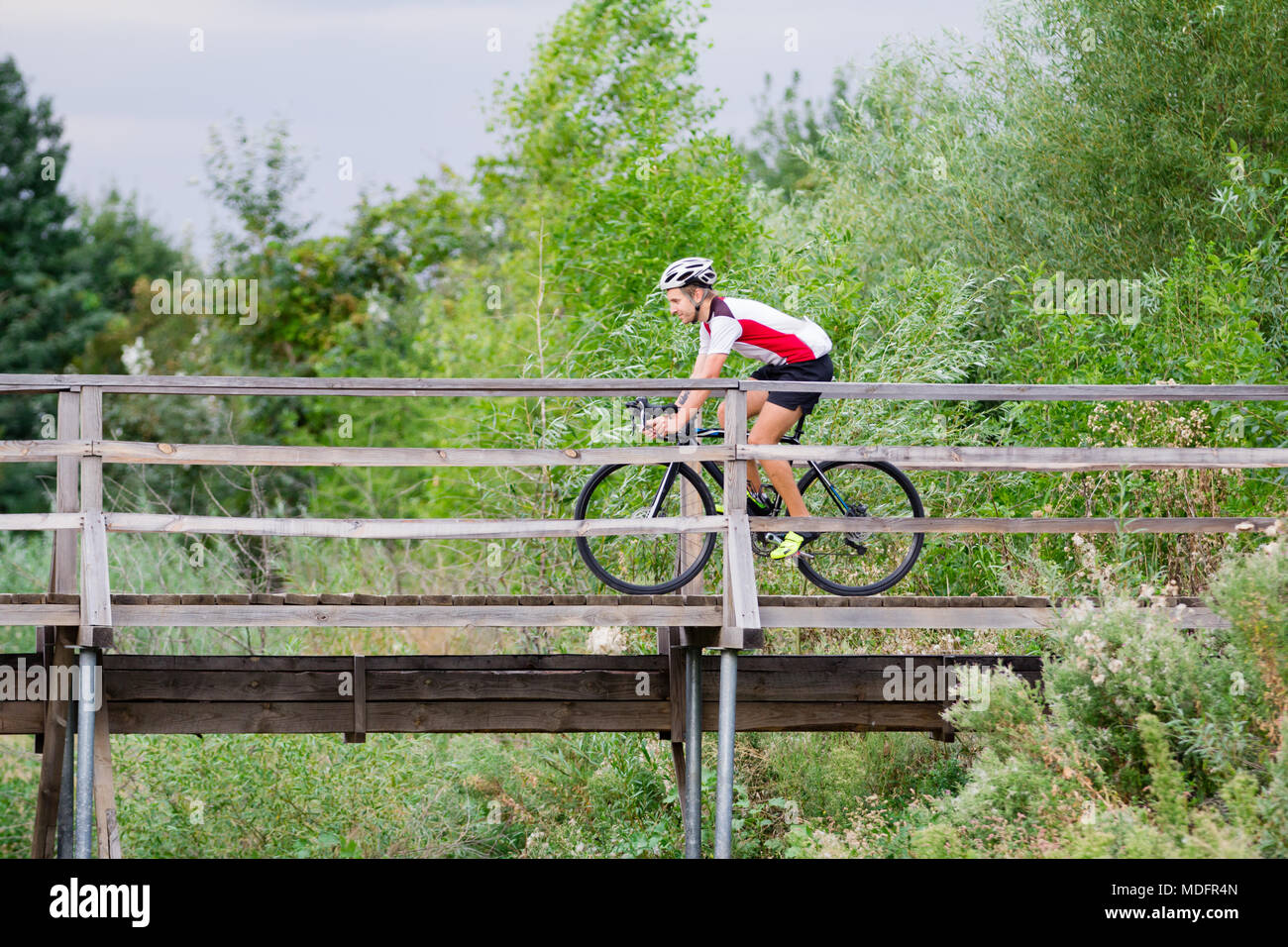 Professional cyclist training offroad riding in fields, bicycle rider