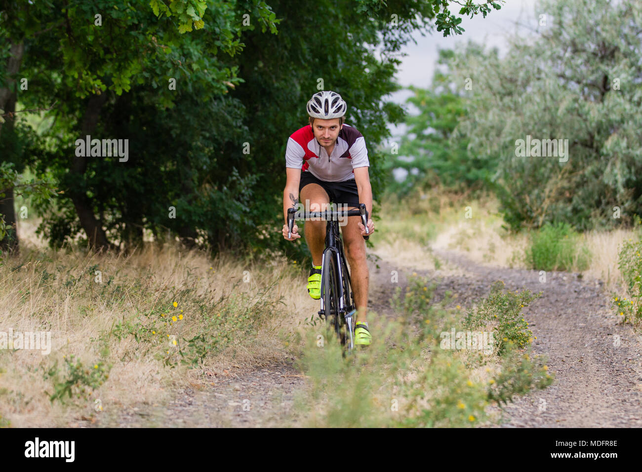 Professional cyclist training riding bicycle hi-res stock photography ...