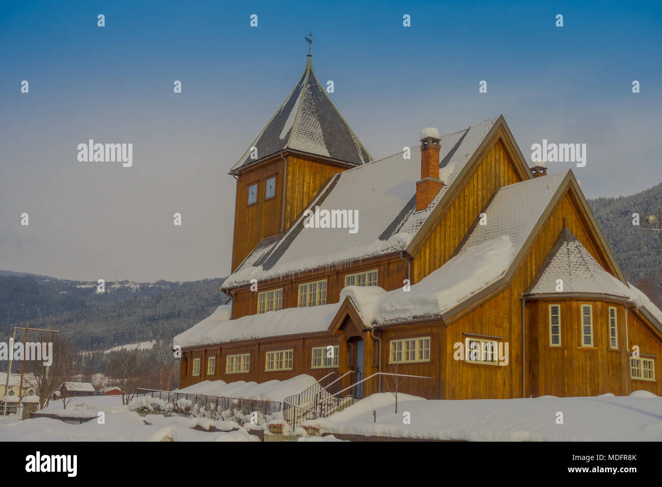 Outdoor view of the Stave Church partial covered with snow during a heavy winter season in Gol Stock Photo