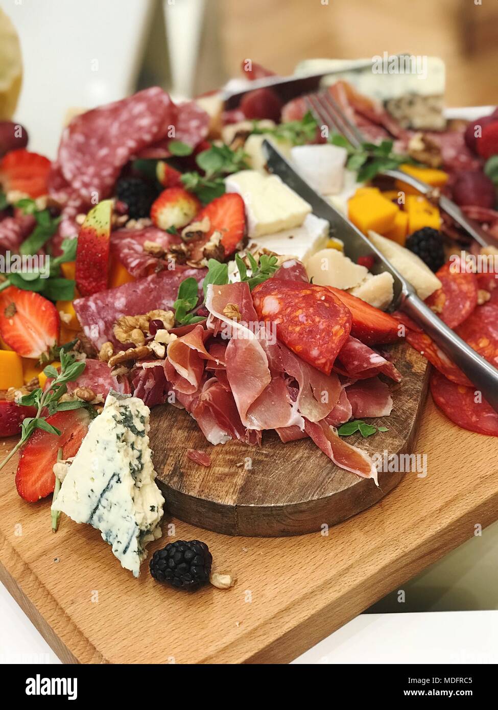 Cured meat and cheese antipasti with fruit and nuts Stock Photo Alamy