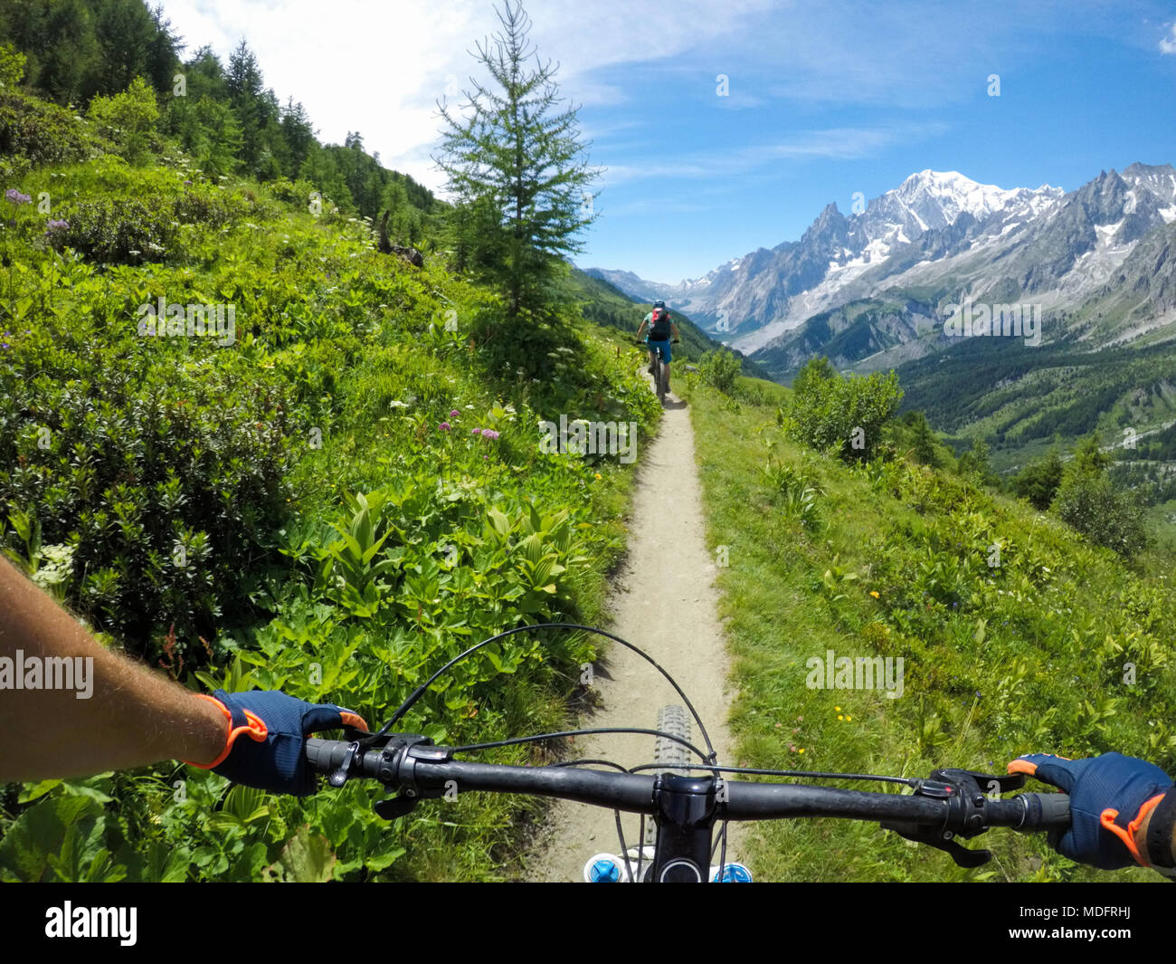 Two men mountain biking in Dolomites,Cormayeur,Italy Stock Photo