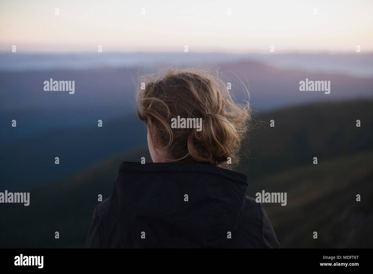 Woman looking at Carpathian mountain view, Ukraine Stock Photo