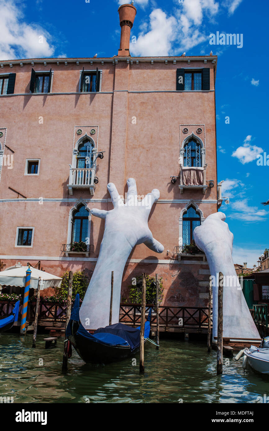 Sculpture Support: Monumental hands rise from the water in Venice to highlight climate change Stock Photo