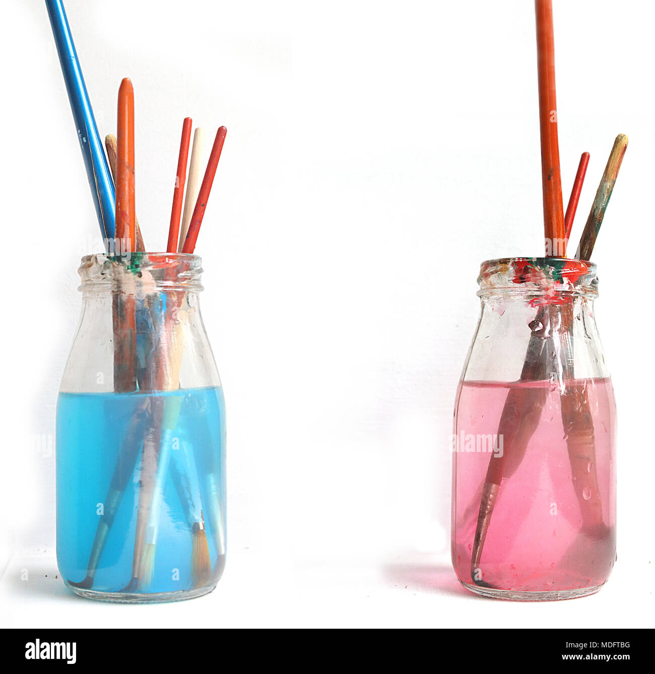 Paintbrushes in bottles of water Stock Photo Alamy