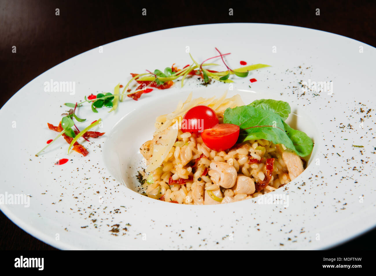Chicken and sun dried tomato risotto Stock Photo Alamy