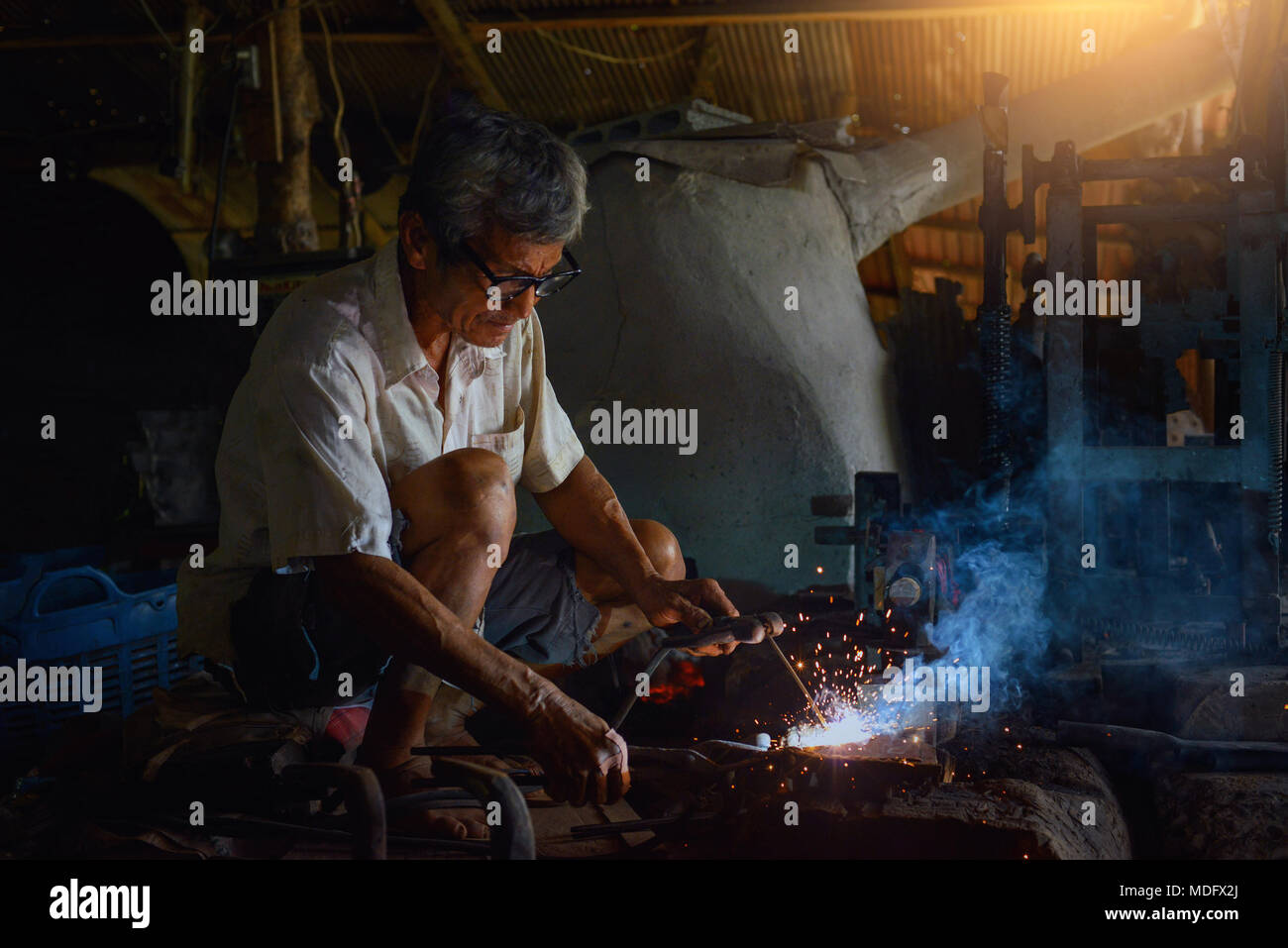 Metal worker in a steel factory, Thailand Stock Photo