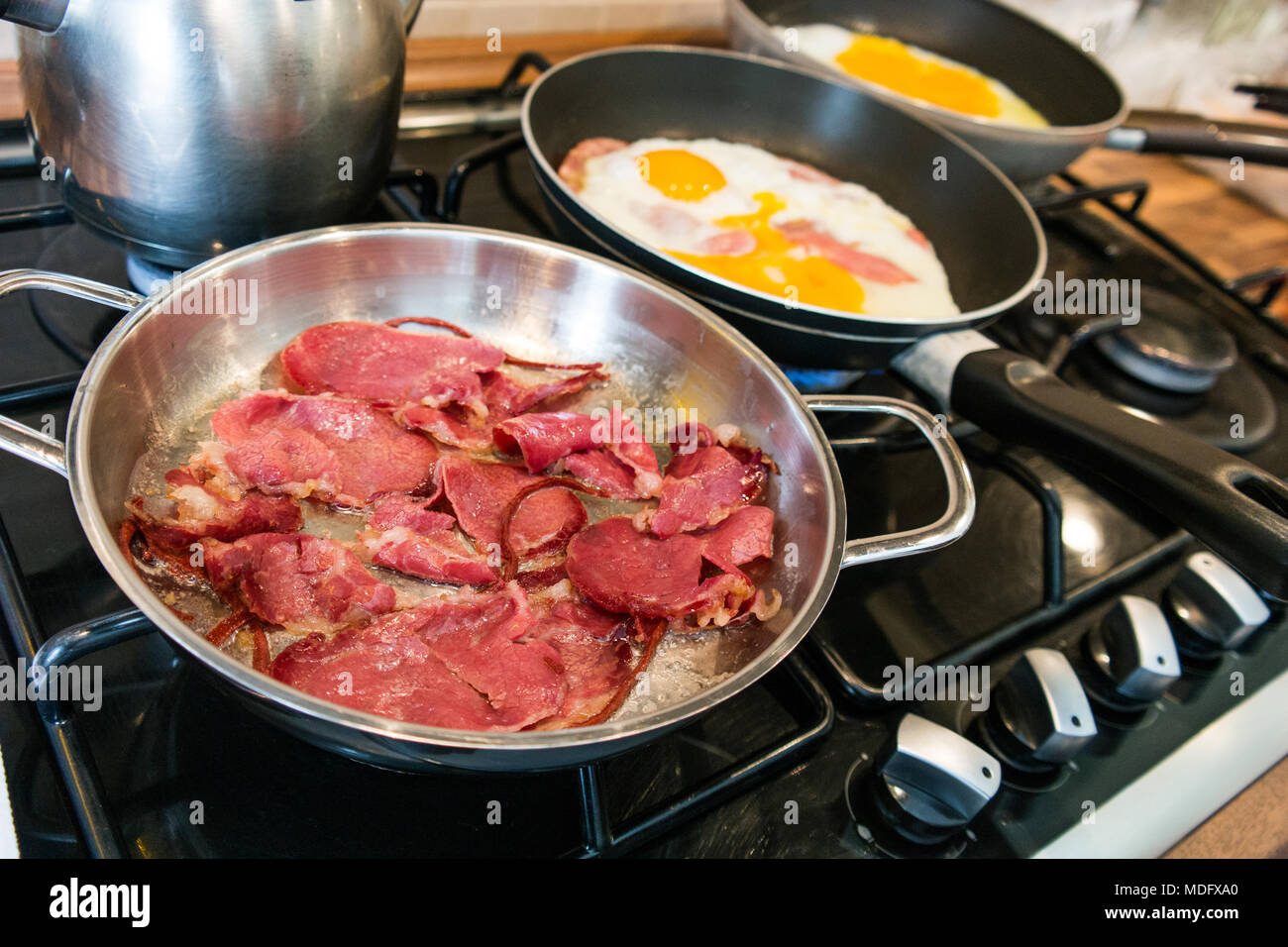 turkish pastirma / pastrami bacon in a frying pan at home Stock Photo
