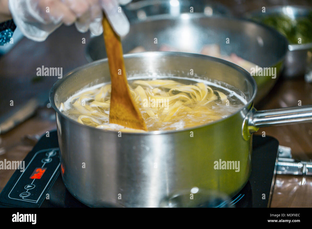 Chef stir Spaghetti in a pot of boiling water. boiling spaghetti Stock Photo Alamy