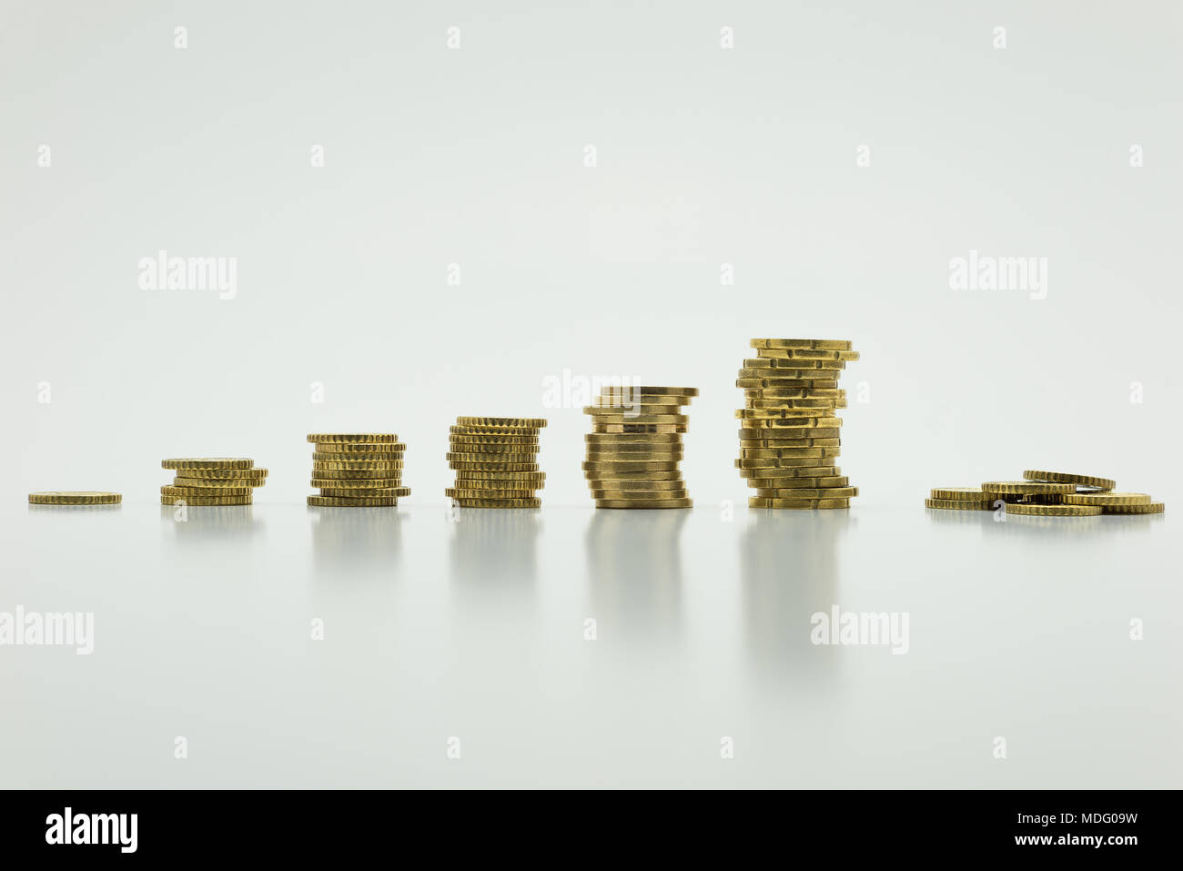 Stack of gold coins, six rows isolated on white background with ...