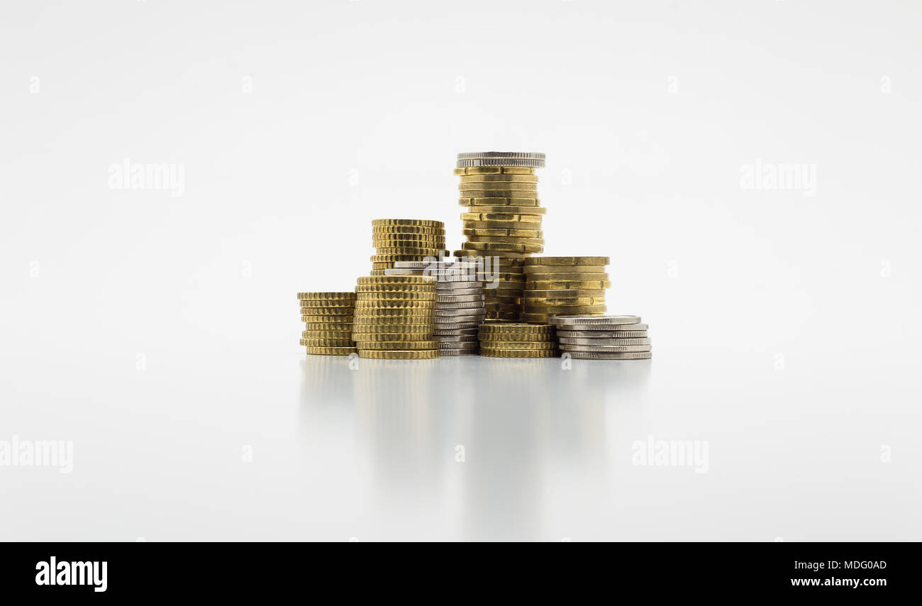 Stack of gold and silver coins isolated on white background with ...