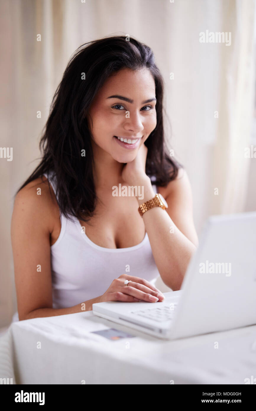 Girl shopping online using her credit card Stock Photo