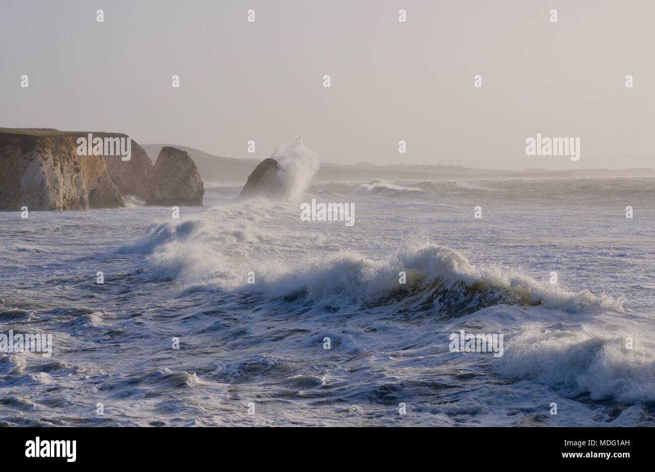 rough sea with large waves crashing onto rocks at Freshwater Bay, Isle of Wight, United Kingdom Stock Photo