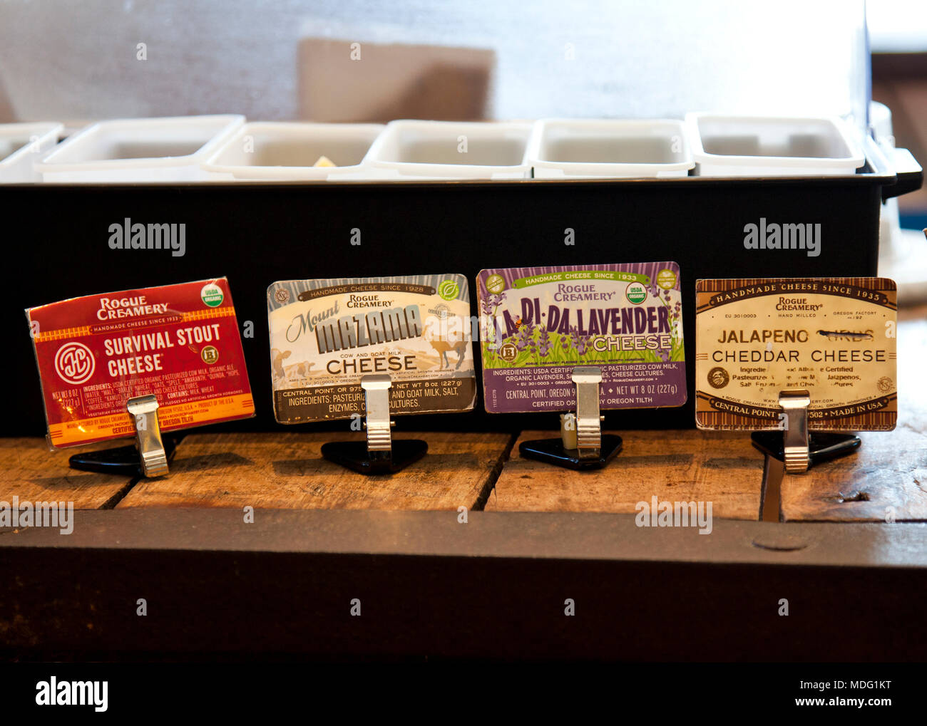 Artisan cheese labels at tasting bar, Rogue Creamery Cheese Shop, Medford, Oregon. Stock Photo